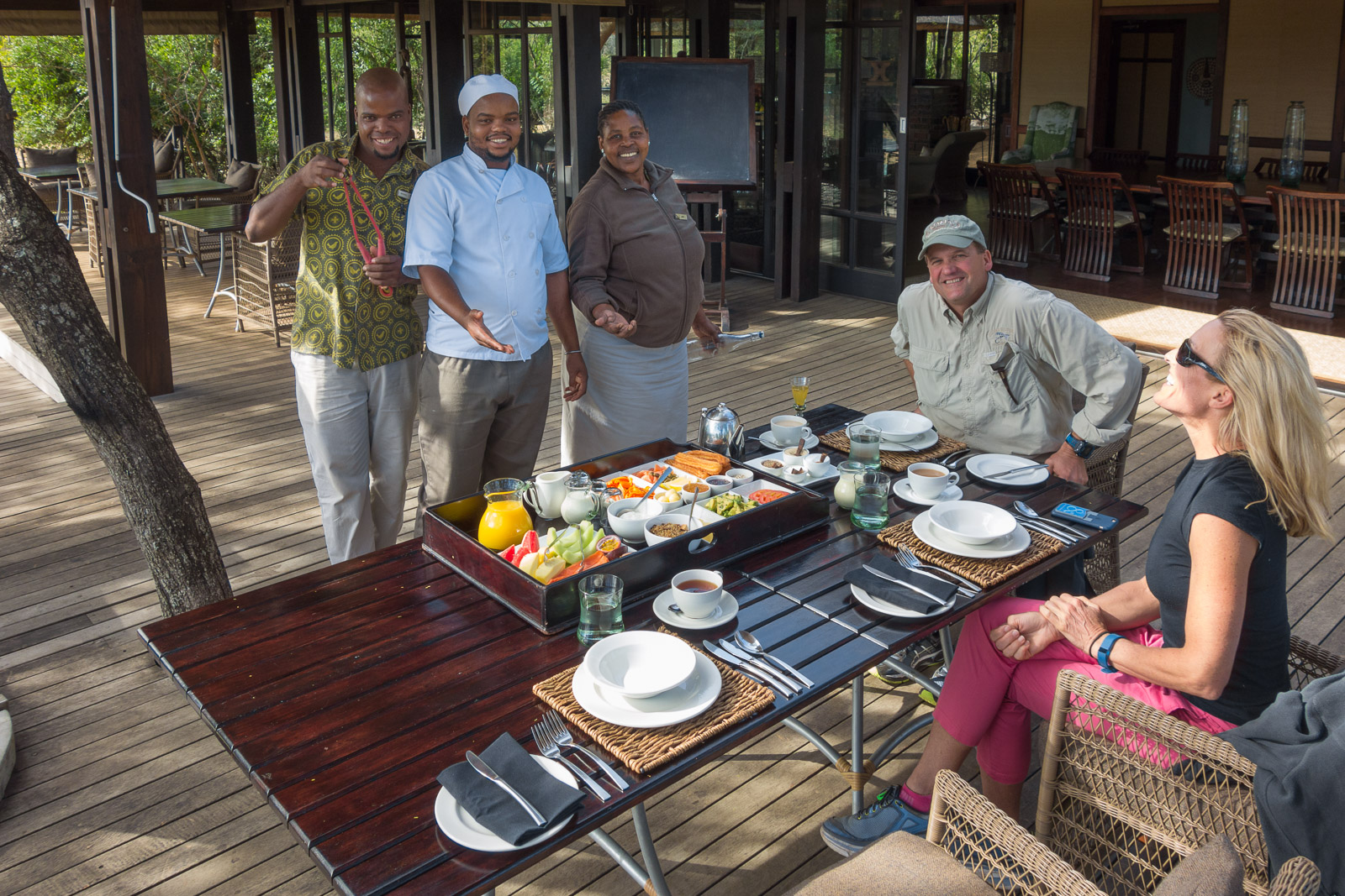 Lodge staff: Michael (monkey slingshot in hand), Chef Magic, and Jabu.
