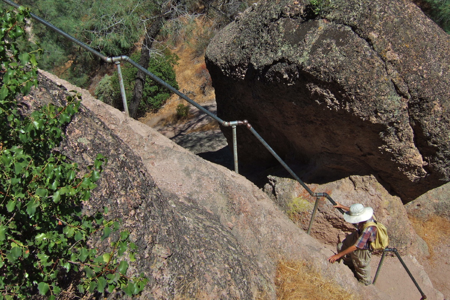 David climbs the first steep stairway with railing.