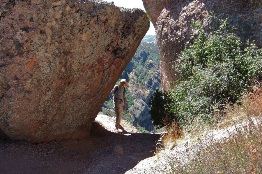Bill stands in a rock window.