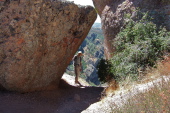 Bill stands in a rock window.