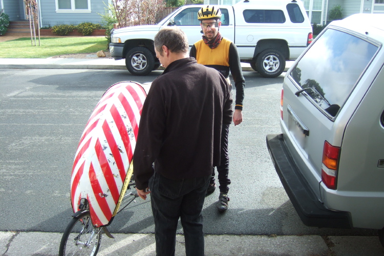 Tim Woudenberg looks over the battle scars on the fairing.