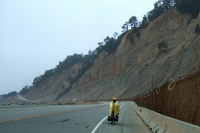 Zach rides past the cliffs near Waddell Beach.