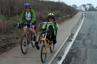 Passing two ladies enjoying their ride up the coast.