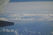 Somewhere in the clouds is Maui and Haleakala