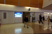 David exits the mens room after the end of the flight.