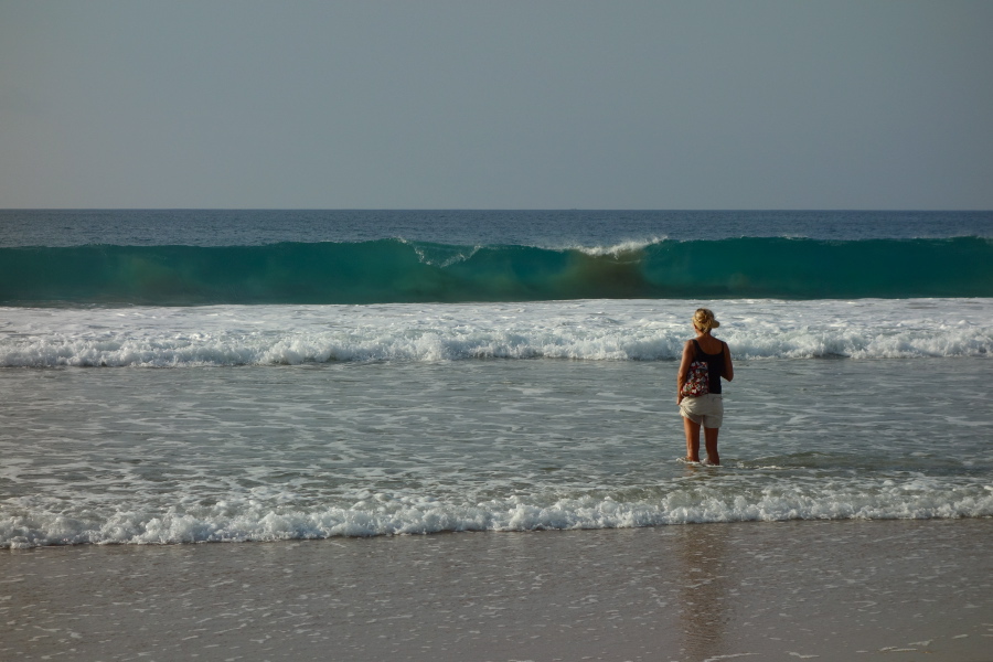 Laura watches the waves break.