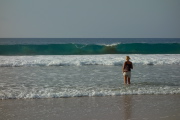 Laura watches the waves break.