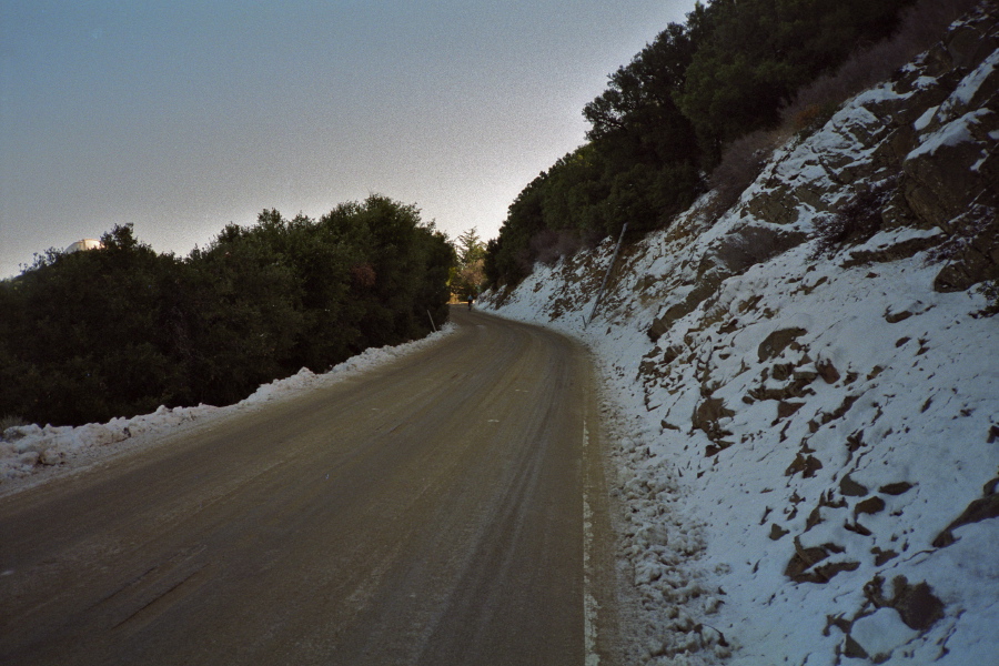 Snow by the road (and dirty slush on it) near the summit.