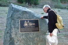 David reads the plaque.