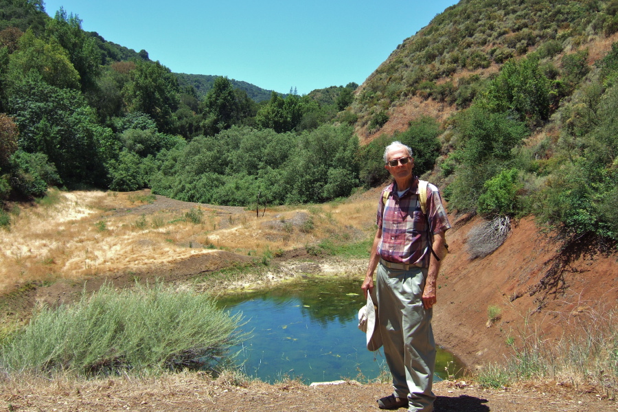 David stands before the small pond in Rogue Valley.