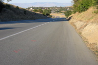 Marks on the road after the oil splats.