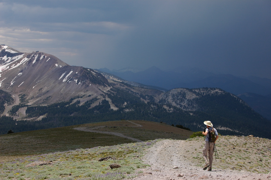 Bill walks down San Joaquin Ridge into a dark sky.