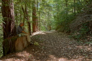 David rests his feet at this comfortable tree stump on Saratoga Toll Road.