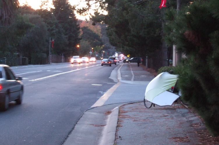 Waiting for a ride along busy Ralston Ave., Belmont.