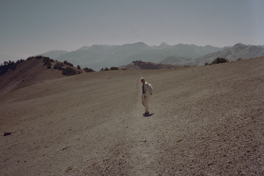 David walks down the use trail from the Teats across the barren landscape.
