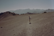 David walks down the use trail from the Teats across the barren landscape.