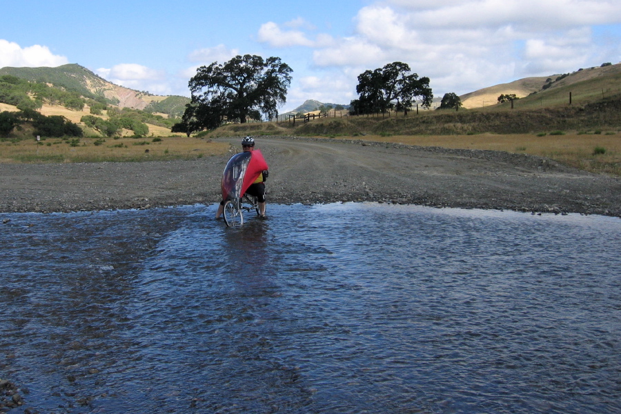 Ron starts to ride through the ford. (1500ft)