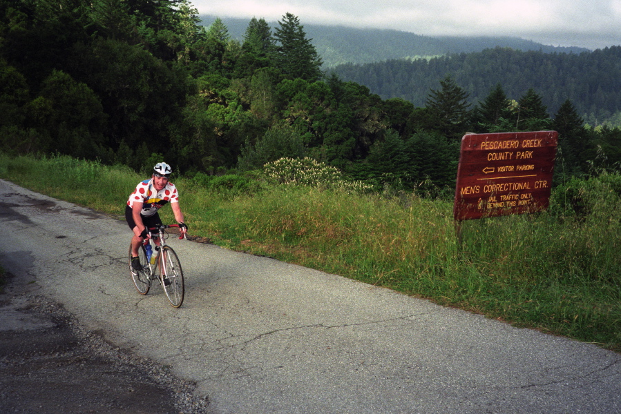 Rider on Mr. Bill's Nightmare route climbing up from Pescadero Creek.