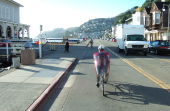 Ron rides down Bridgeway in Sausalito.