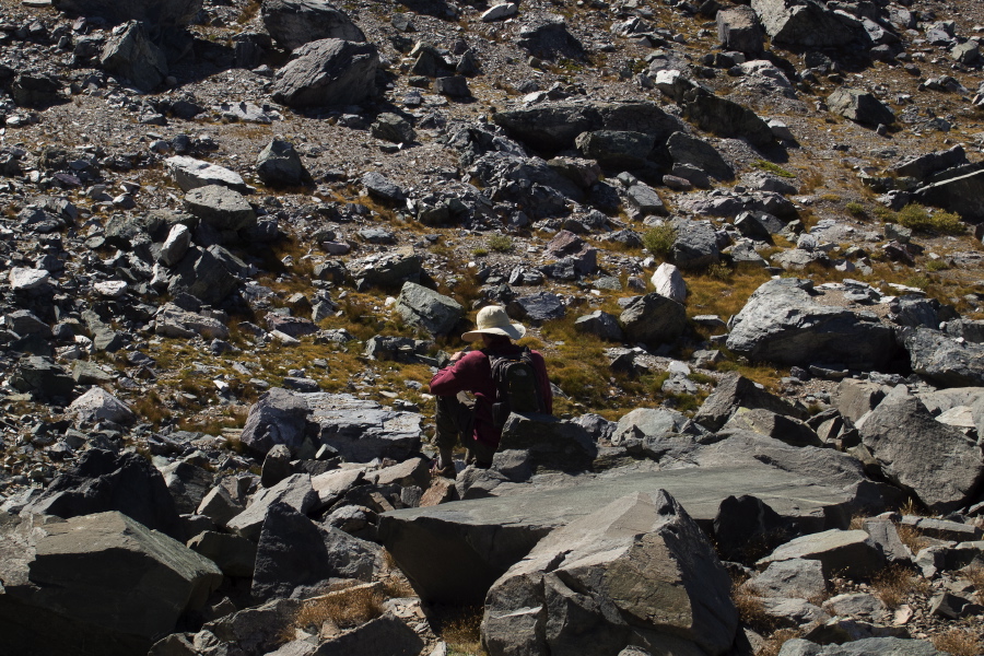 Bill waits for Frank and Stella near the last of the talus.