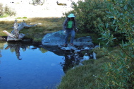Stella gets across the corner of a tarn.