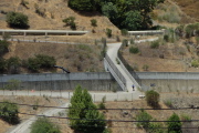 Frank heads across the spillway channel on his way home.