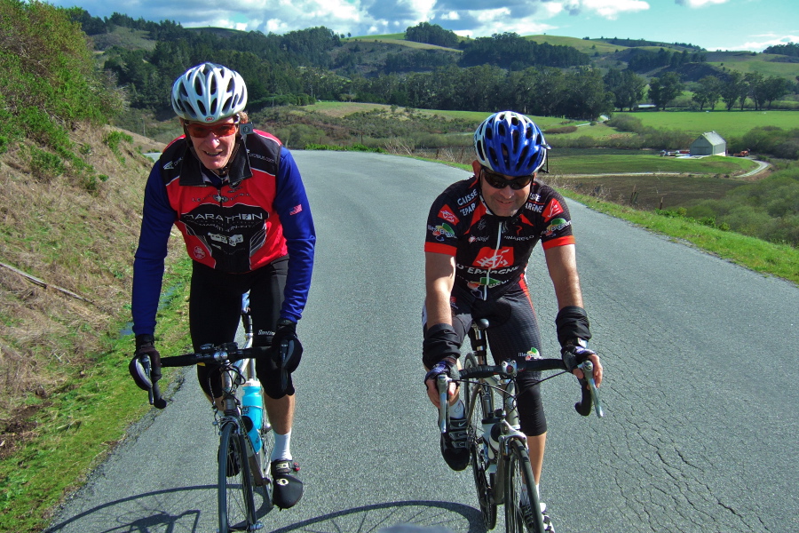 Bob ? and Patrick Goebel (r) climb Stage Rd. out of Pescadero.