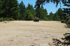 Dad and son enjoy quality time on an off-road vehicle.