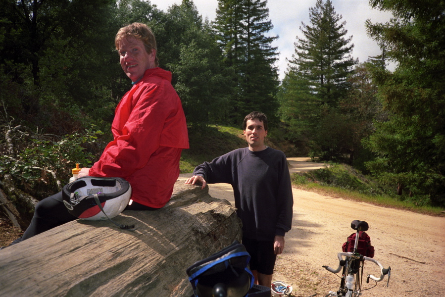 Chris and Bill rest at the big log at the top of China Grade Rd.