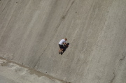 Boy tries to climb the wall of the Stevens Creek Reservoir spillway