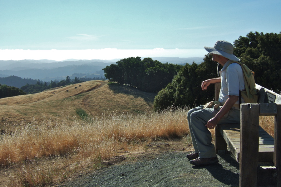 David enjoys the bench at the high point on Long Ridge