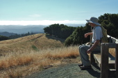 David enjoys the bench at the high point on Long Ridge
