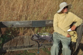 David rests on the Leonard L. Schiff bench.