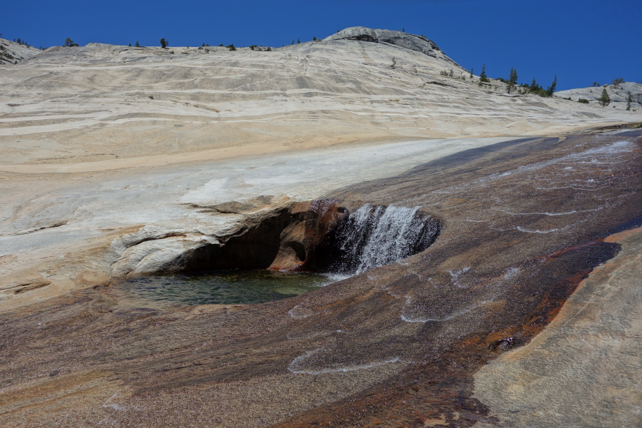 Every so often a large pot-hole appears in the granite.