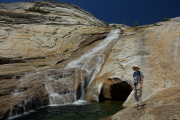 Bill stands at the edge of the pool.