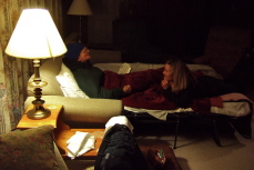 David and Laura relax in the living room.