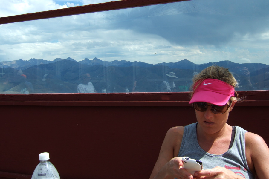 Laura checks her iPhone.