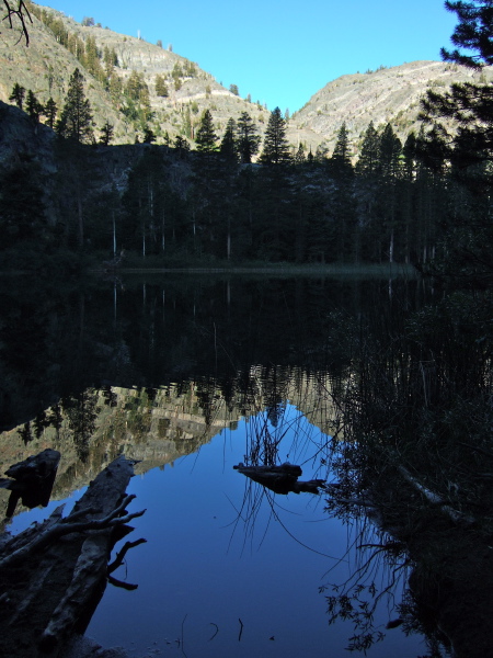 Olaine Lake reflecting the cleft down which runs Shadow Creek