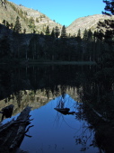 Olaine Lake reflecting the cleft down which runs Shadow Creek