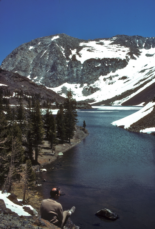 David rests on a rock overlooking Ellery Lake.