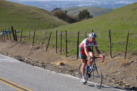 Zachary Grabowski hauls himself to the summit of Sierra Rd.
