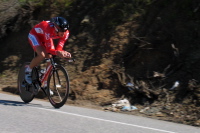A CSC rider in skinsuit crests Bailey Rd.