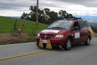 Broom wagon sweeping the course.