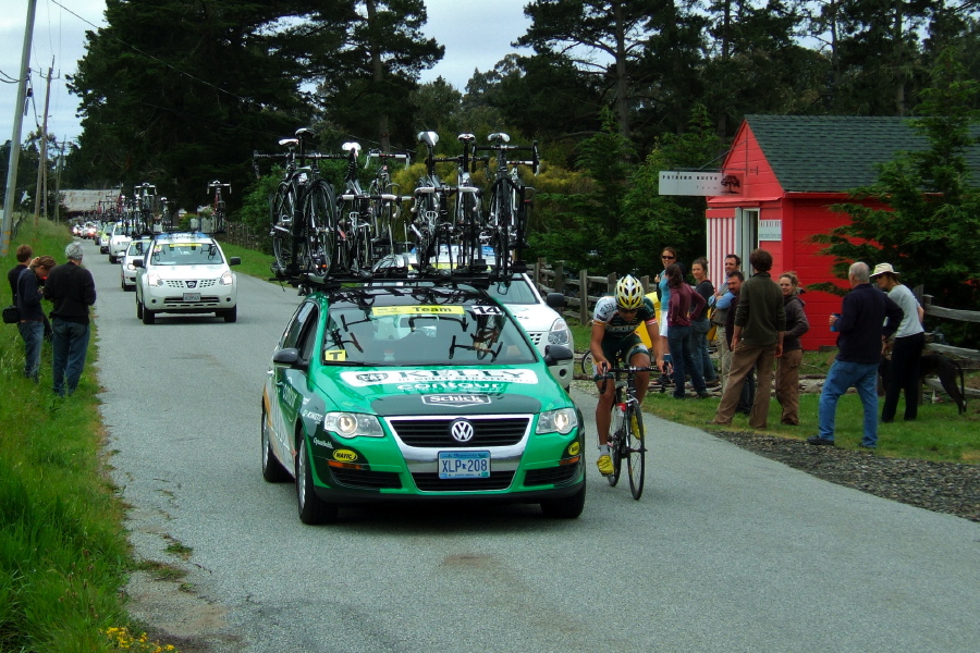 One rider is back amongst the team cars.