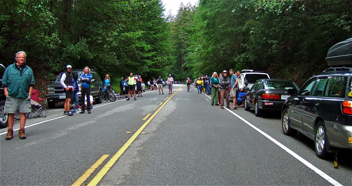 Fans watch the first spectacle pass by.