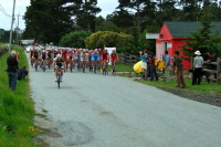 The Peloton passes The Bike Hut.