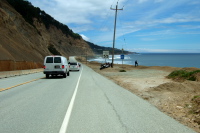 Motorcycle cops take a break to enjoy the view before the race comes by.