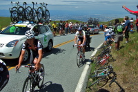 Two Team Cervélo riders and one Team Type 1 rider in the caravan.