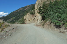 The road continues as dirt.