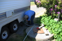 Dumping the tanks of the Particleboard Palace.